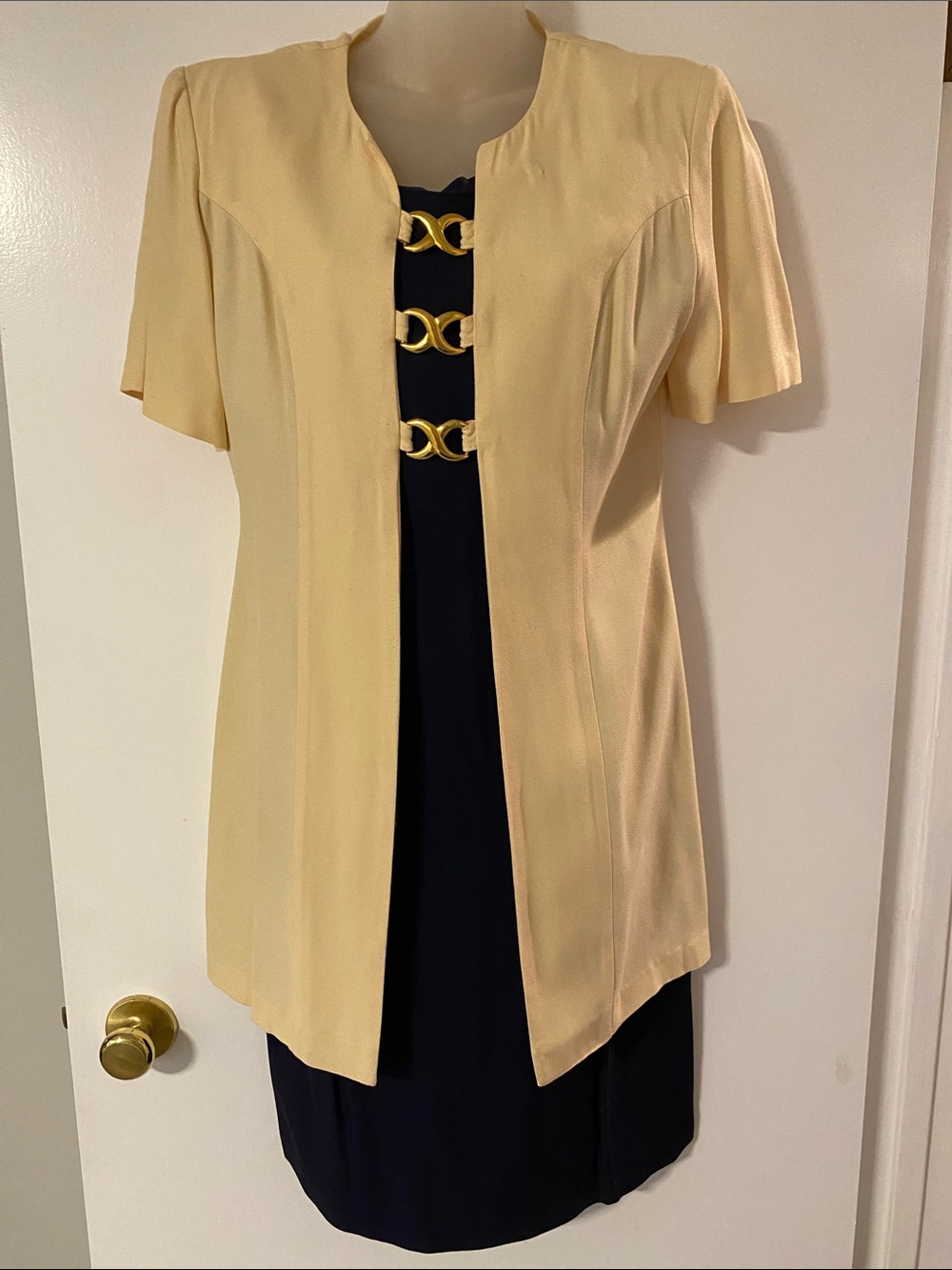 Cream Short Sleeve Open Jacket with Navy Dress and Gold Accent